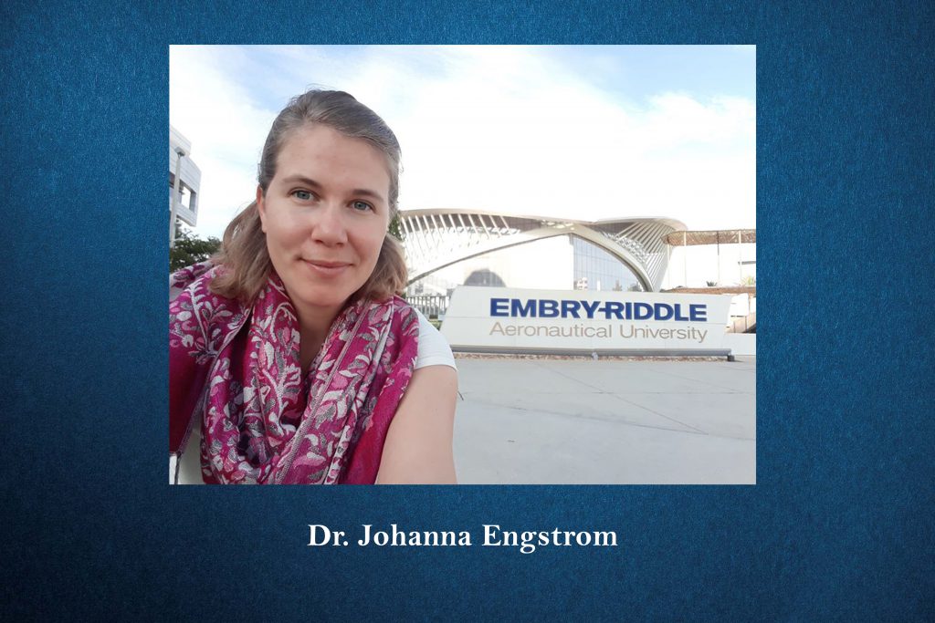 Dr. Johanna Engstrom outside with the Aeronautical University sign